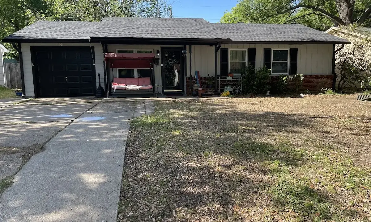 Asphalt Shingle Roof Repair crew at work on a residential roof in Newberry